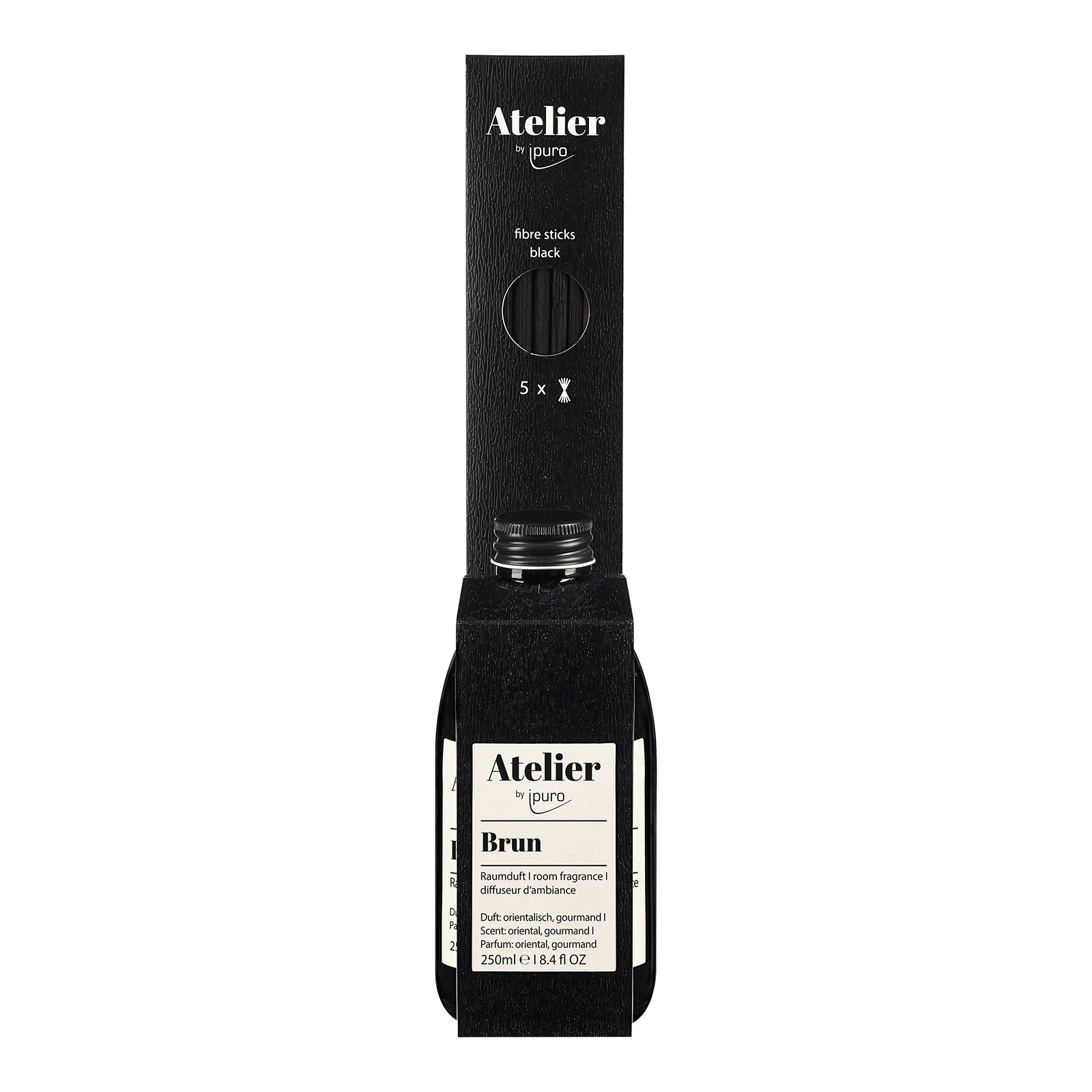 Ein schwarzer rechteckiger ipuro Atelier by ipuro brun Raumduft Flakon (250ml) steht vor seiner passenden schwarzen Verpackung und zeigt ein minimalistisches, modernes Design - ideal, um Ihren Raum mit warmen Aromen oder erdigen Noten zu erfüllen.