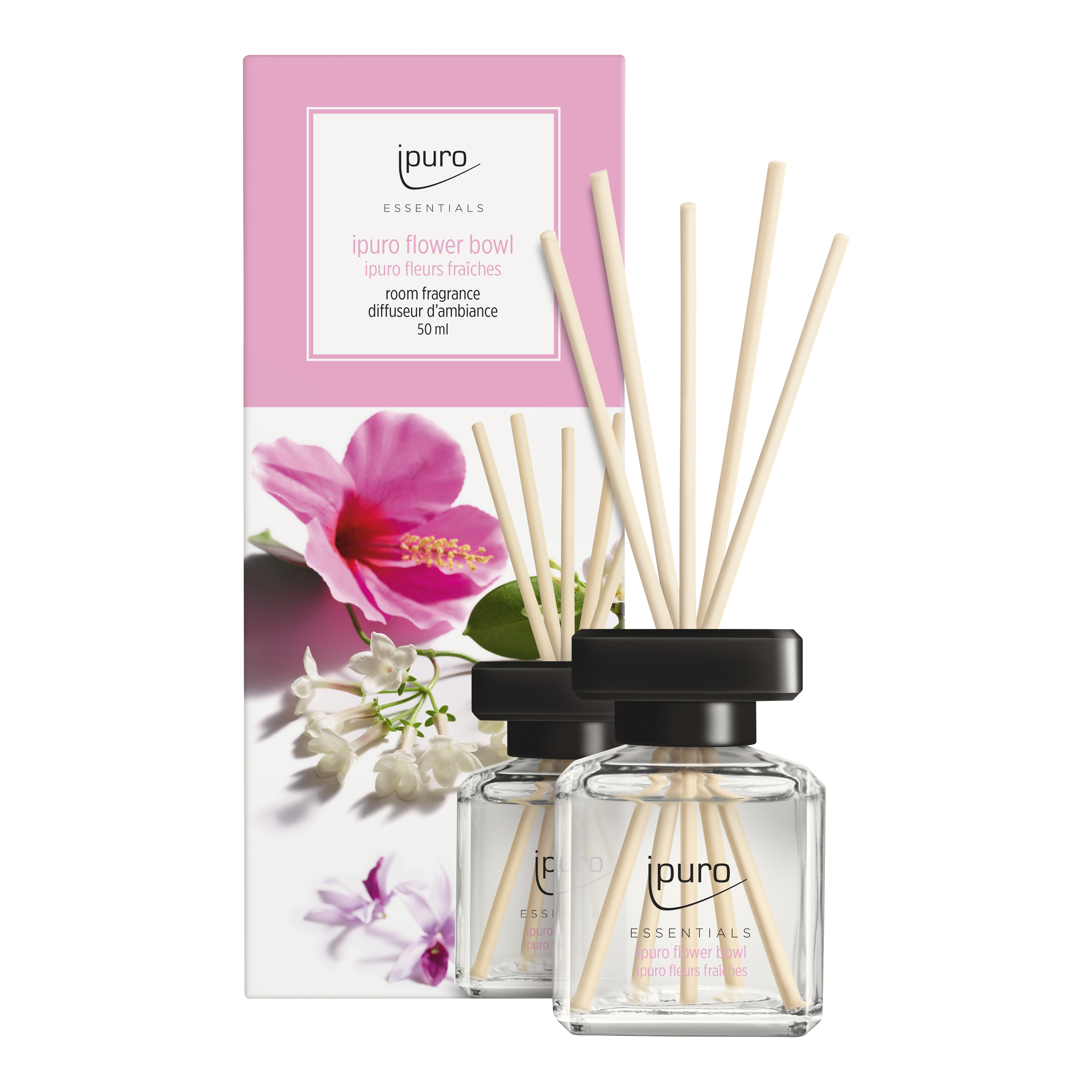 Zwei Glasflaschen der ESSENTIALS ipuro Blumenschale Raumduft von ipuro, mit hölzernen Diffusorstäbchen, stehen vor einer rosafarbenen Schachtel mit floralem Design und Details, die belebende Frische und einen blumigen Touch in jeden Raum bringen.