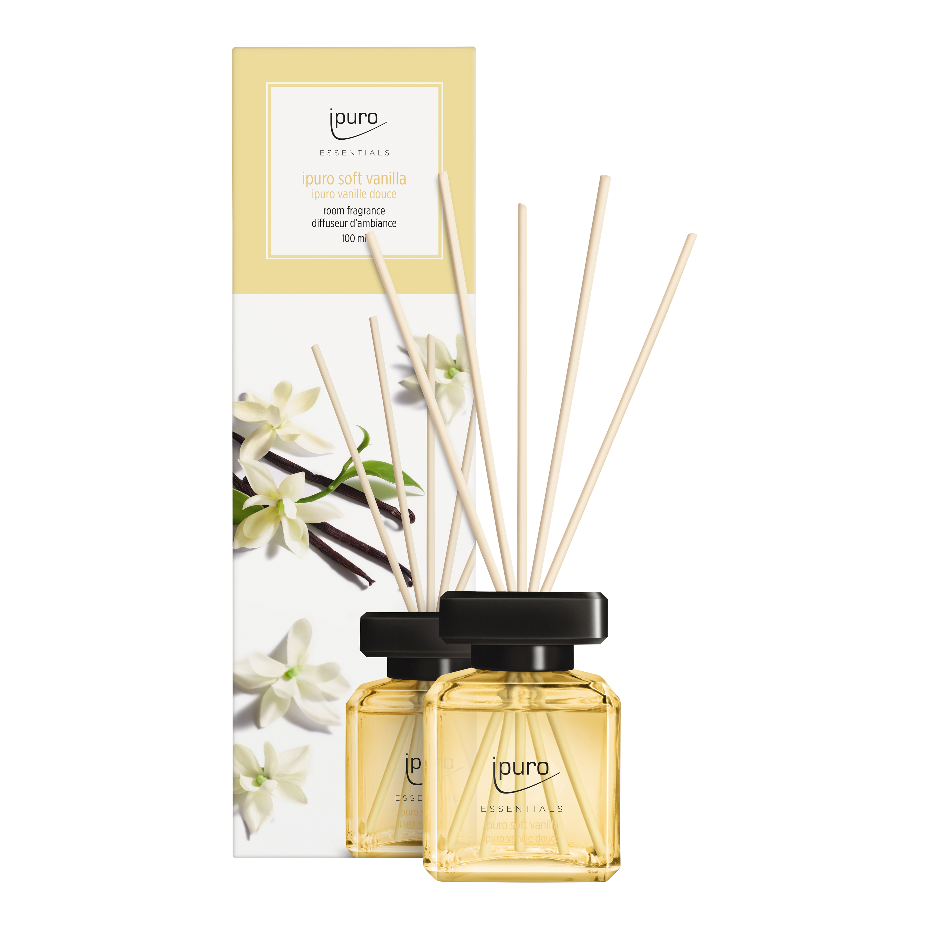 Eine Schachtel mit zwei Glasflaschen von ESSENTIALS ipuro soft vanilla Raumduft von ipuro, mit Diffusorstäbchen aus Holz und einer mit Vanilleblüten verzierten Verpackung. Der hellgelbe Duft kombiniert warme, einladende Vanille-Noten.