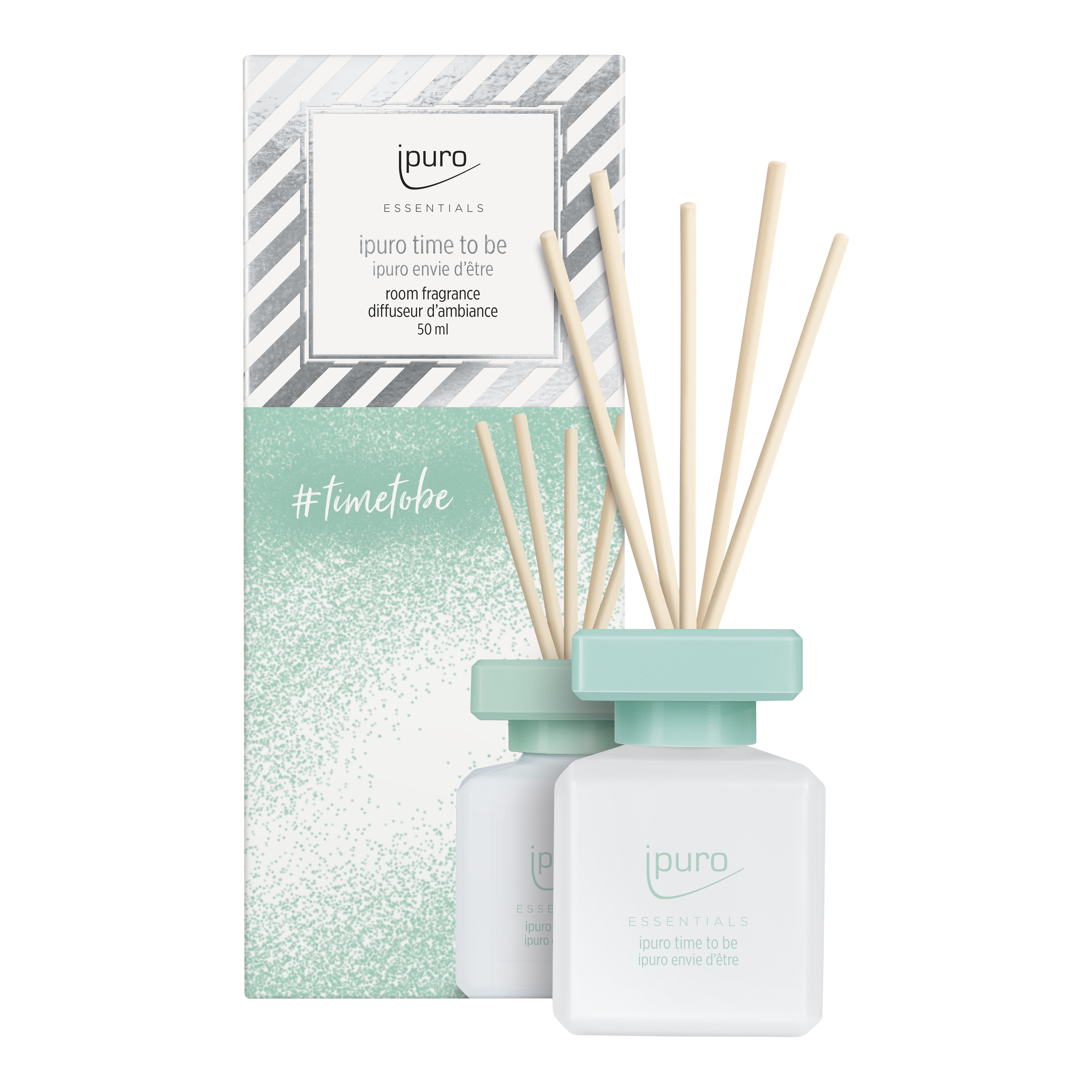 Der ESSENTIALS ipuro time to be Raumduft von ipuro, in weiß und mintgrün mit Diagonalstreifen und #timetobe auf der Schachtel, erfüllt Ihren Raum mit einem karamellig-fruchtigen Duft.