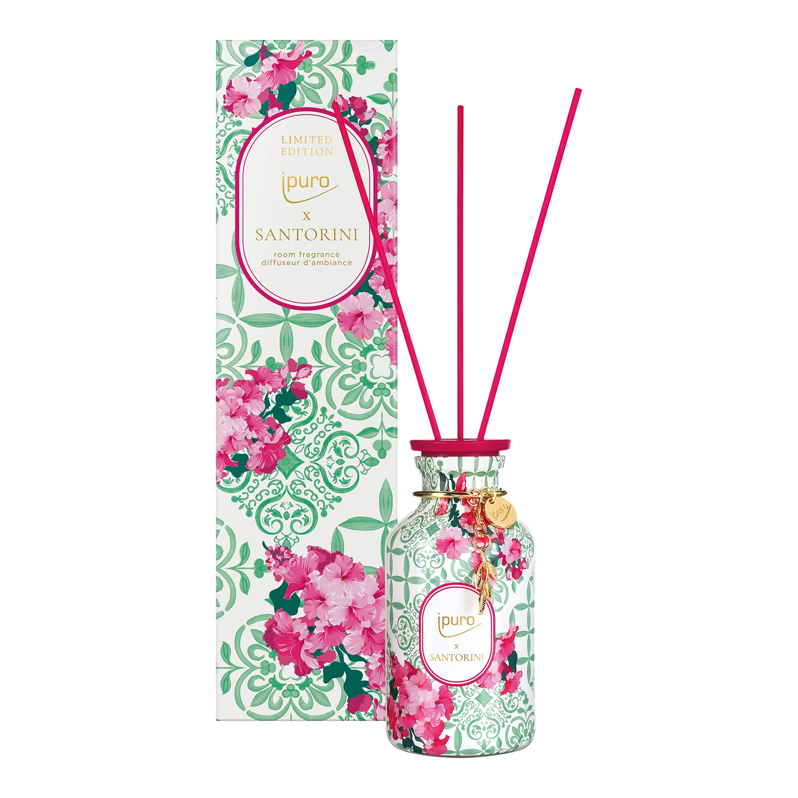 Der ipuro santorini Raumduft LIMITED EDITION von ipuro ist ein floral gemusterter Glasschilfdiffusor mit rosafarbenen Schilfrohren, der die Düfte Kokosnuss Vanille und weißer Moschus enthält, sowie eine passende dekorative Schachtel mit dem Text "Limited Edition".