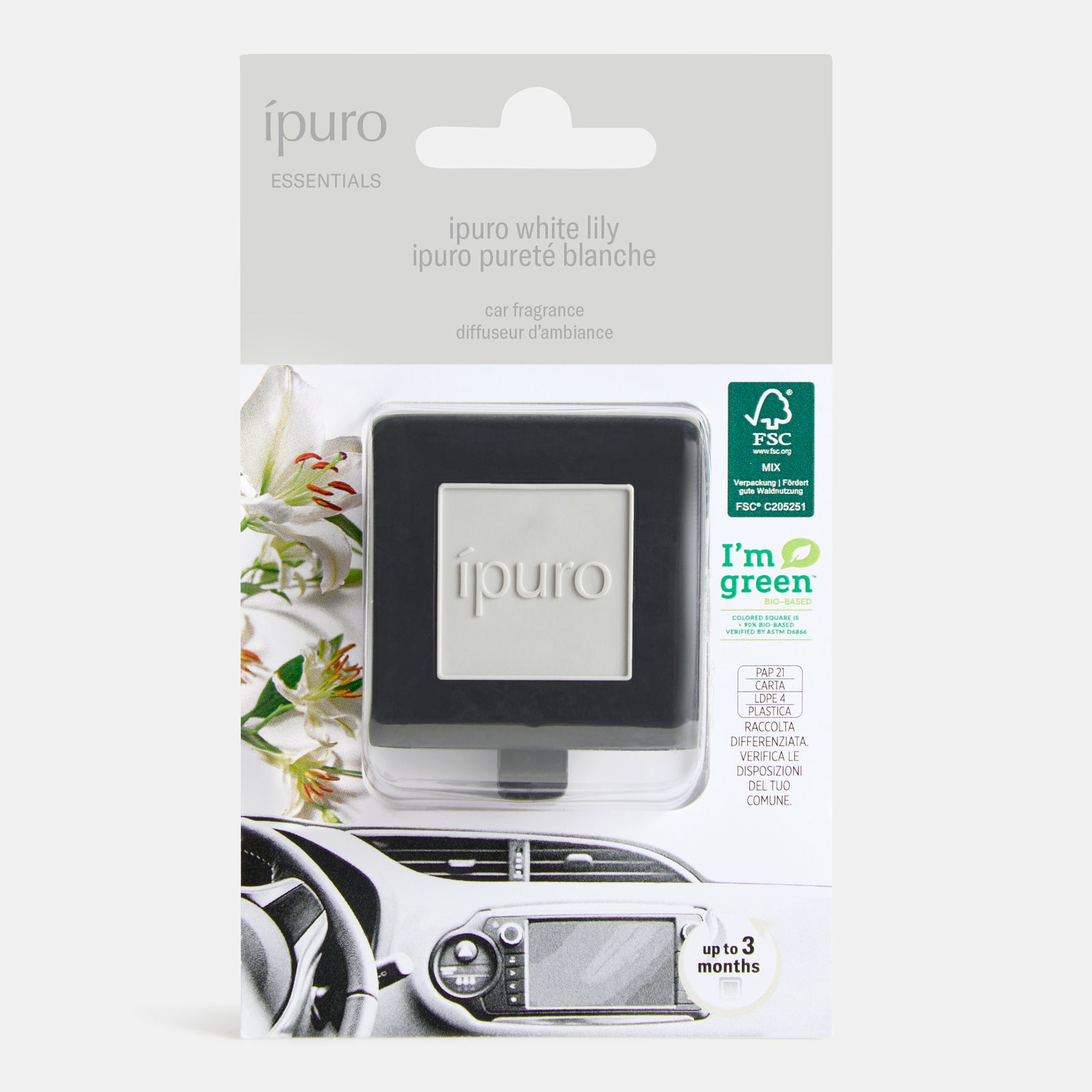 Der verpackte ipuro Autoduft Diffusor mit weißer Lilie hat ein schwarz-silbernes, quadratisches Design. Auf der Schachtel sind Blumen, umweltfreundliche Symbole und ein Foto des Diffusors auf einer Autoentlüftung für ein blumiges Dufterlebnis abgebildet.