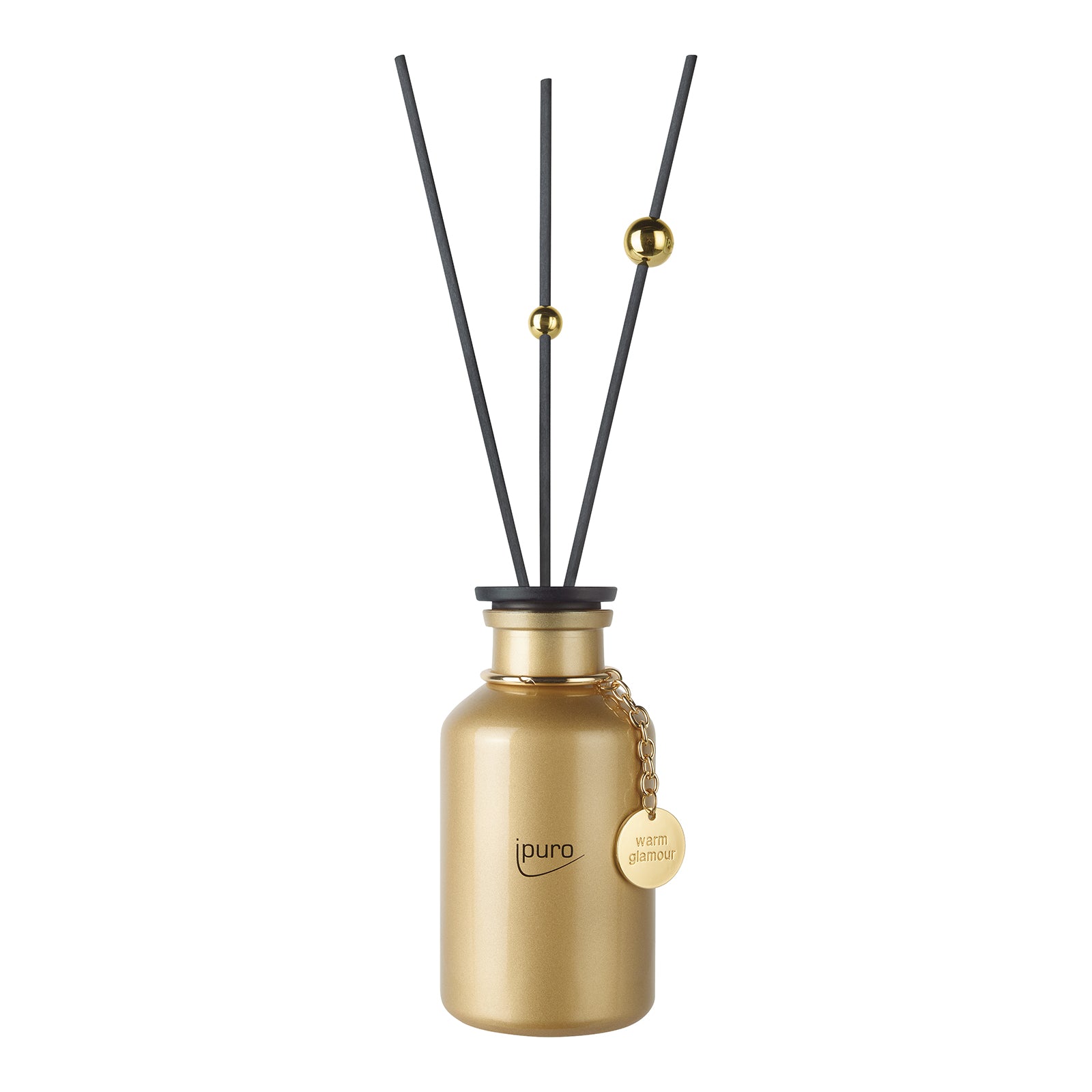 Der LIMITED EDITION ipuro warm glamour Raumduft von ipuro besteht aus einem goldenen Diffusor-Fläschchen mit schwarzen Stäbchen, goldenen Perlen und einem runden Anhänger, der Ihren Raum mit Glamour Duft und Vanille Parfum-Noten bereichert.