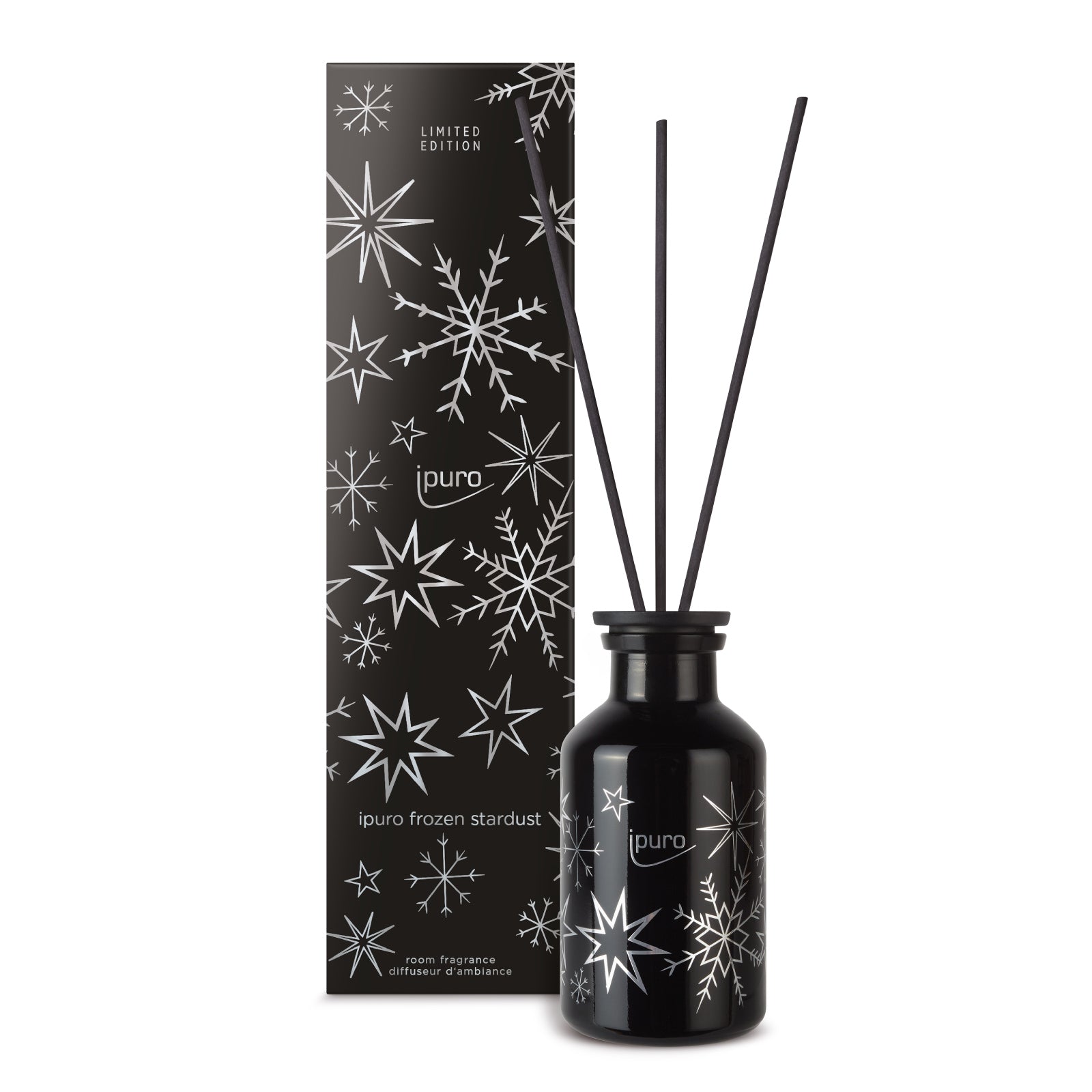 Ein schwarzer ipuro frozen stardust Raumduft 240ml Diffusor mit schwarzem Schilf und passender Box, beide mit weißen Sternen und Schneeflocken, limitierte Auflage.